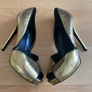 Alexander McQueen gold and black peep toe stilettos